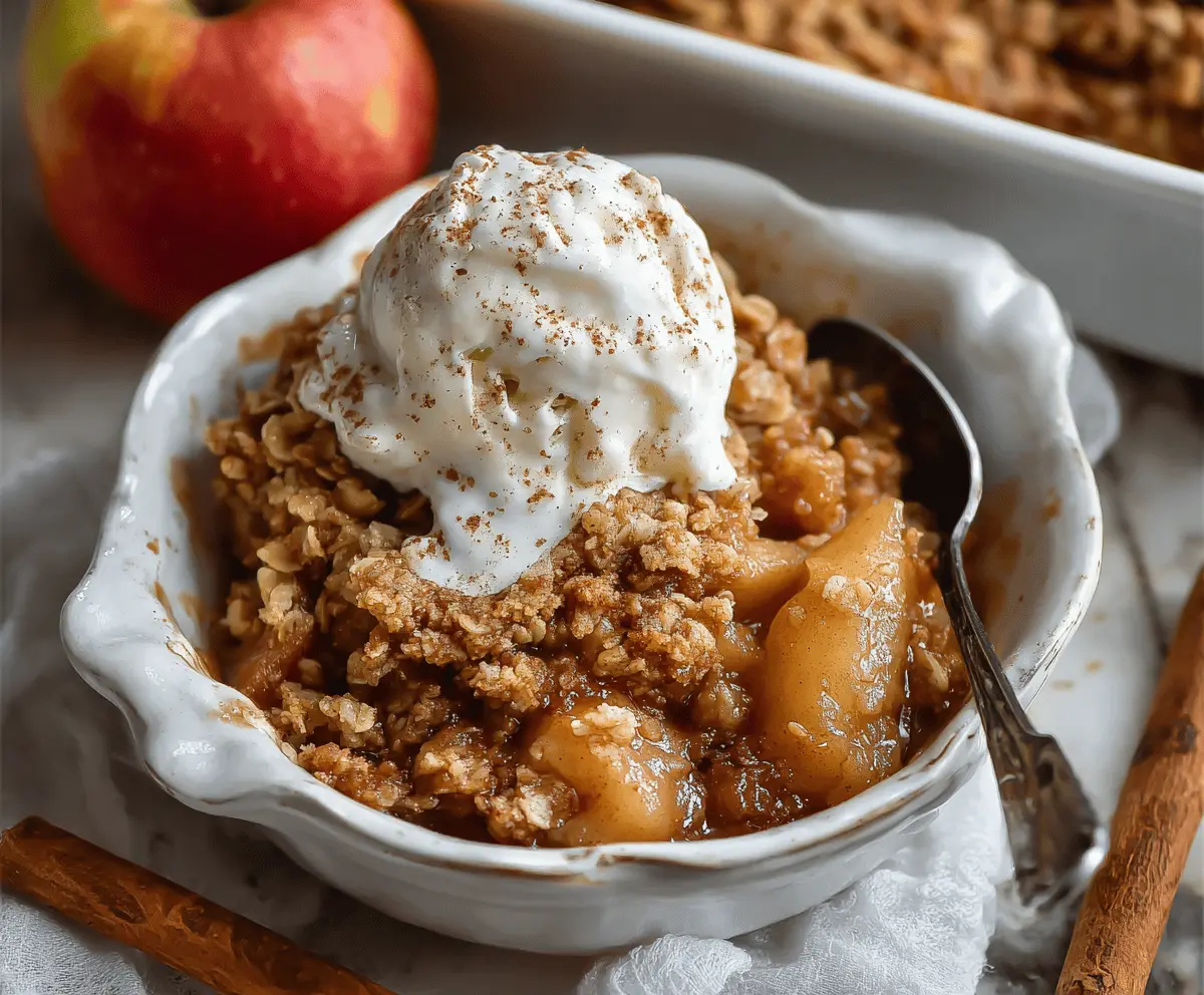 Delicious homemade apple pear crisp with golden-brown topping, served in a rustic baking dish, perfect for a cozy dessert
